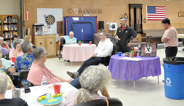 McKENZIE (April 24) &mdash; Will Record, clinic director at Dynamix, was the guest speaker at the McKenzie Senior Citizens Center monthly potluck Thursday. Record spoke about the clinic's MOVE campaign to encourage proactive health journeys with personalized, effective and safe exercise routines. He emphasized the importance of mobility for seniors. He also gave a demonstration of dry needling treatments for various ailments with help from Mayor Ryan Griffin.