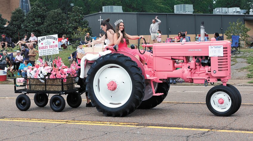 Miss Junior Tater Town Harley Taylor on her pink-colored antique John Deere tractor.