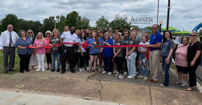 Huntingdon JAG students and faculty cut the ribbon to mark the opening of Storybook Trail.