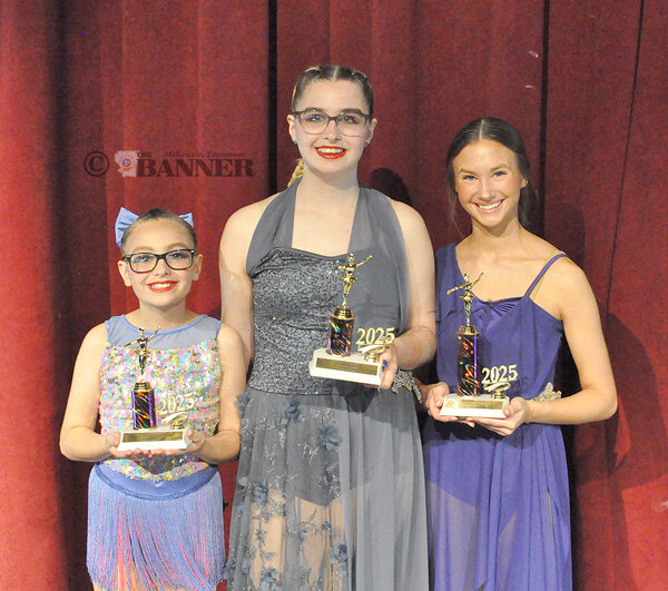 From left, Bella Losby and Kaidy Smith were presented five-year awards and Oliva-Kay Pate was presented a ten-year award.