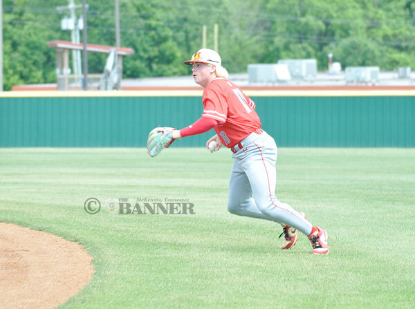 Rebel second baseman Xander Johnsey fields a grounder and throws to first for the out.
