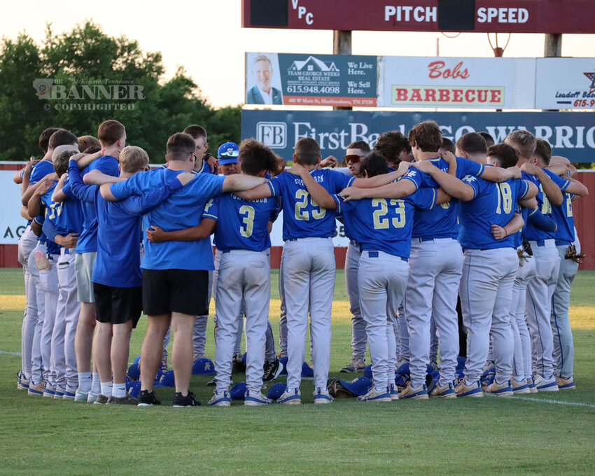 The Huntingdon Mustangs gather as a team before their first tournament game.