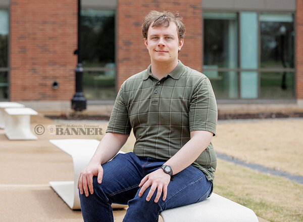 Seth Hatchett of Huntingdon, a rising senior triple-major at UT Martin, was awarded the Goldwater Scholarship in its 2025 cohort. He is majoring in electrical engineering, cell and molecular biology and general chemistry. He plans to graduate in spring 2027. Hatchett is shown sitting outside of the Latimer-Smith Engineering and Science Building on the UT Martin campus.