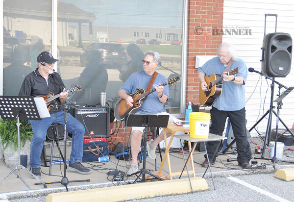 From left, Steve Bomar, Carl Byars and Steve Morris provided music on W.O. Warren Drive for the block party. Not pictured is Mike Wilson, who was also in the rotation of musicians.