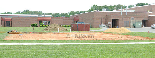 At McKenzie High School, roof work is underway and a pavilion is being constructed.