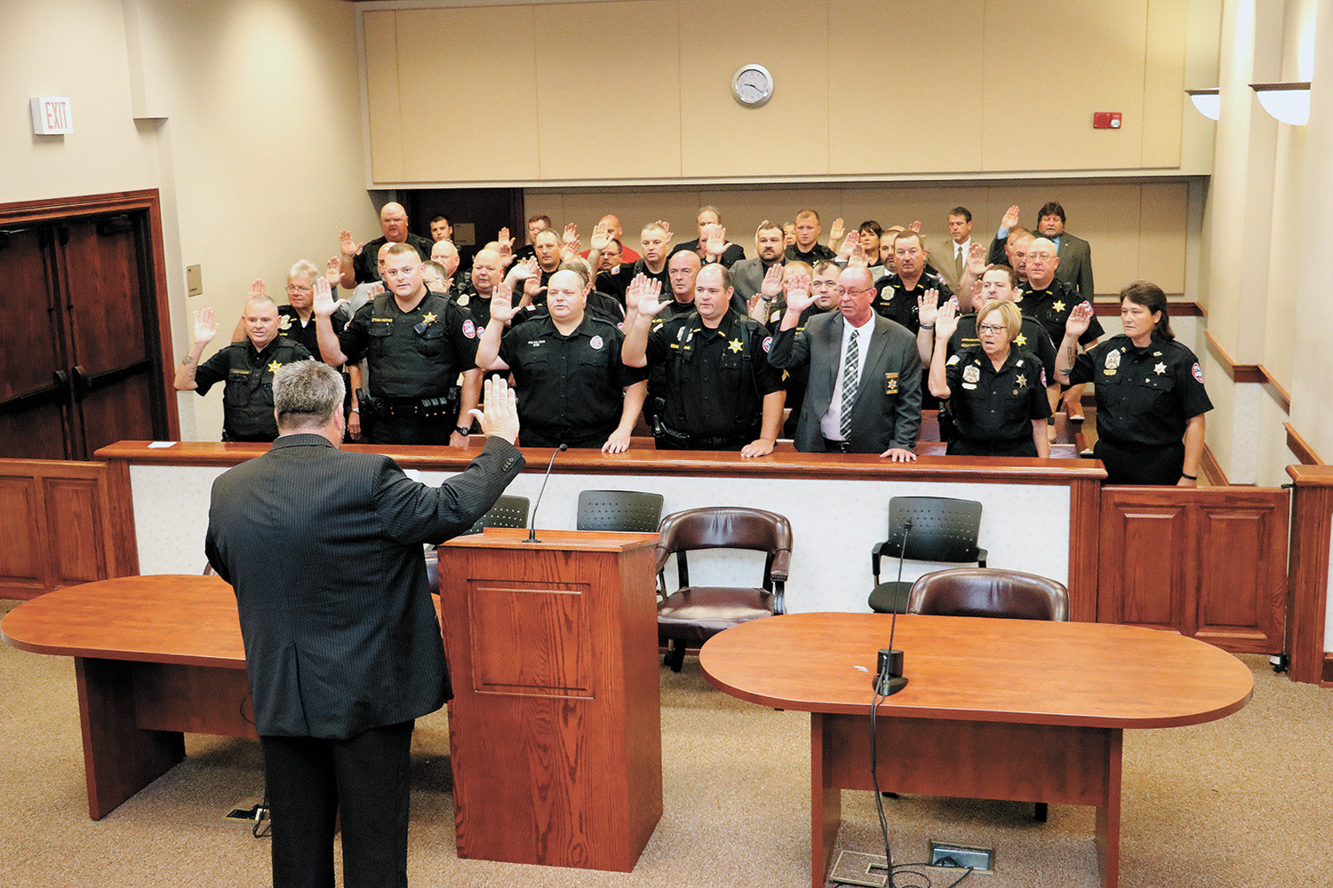 Sheriff Andy Dickson administers the oath of office to his deputies and staff.