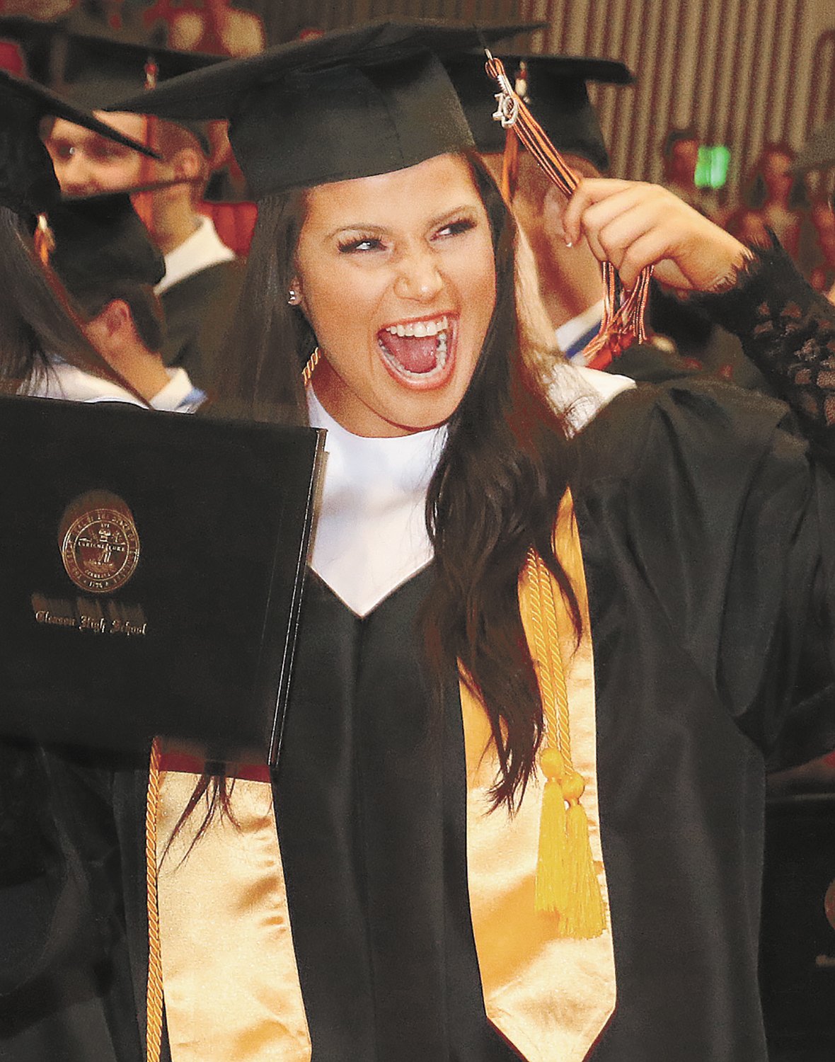 Whitney Clark is all smiles as she changes her tassel from right to left at the Gleason Commencement.