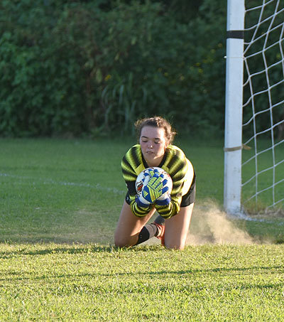 Lady Rebel goalkeeper Gracie Dillingham stops a Dyersburg shot for one of her ten saves in the win.