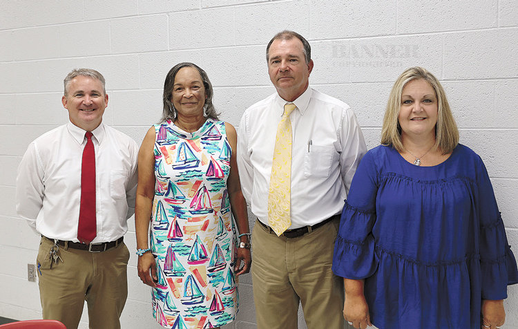 Principals Kelly Spivey from McKenzie High School, Dorothea Royle from McKenzie Middle School and Tanya Brown from McKenzie Elementary School are pictured with Director of Schools Lynn Watkins.