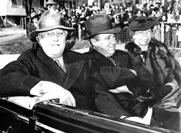 President Franklin Roosevelt (left) rides with his wife, Eleanor (right), and Gordon Browning (center).