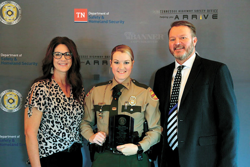 Trooper Brenna Smith with parents Kim and Larry D. Smith of McKenzie.