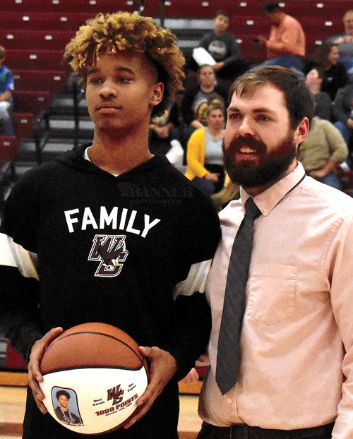 Jalen Anglin and West Carroll Coach Ryan Mansfield. Anglin received his 1,000 point ball and is close to 1,500 career points for the War Eagles.