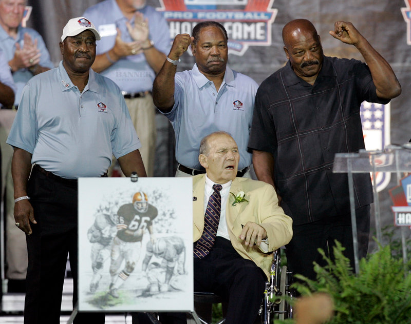 In 2007, Gene Hickerson (seated) was enshrined into the NFL Hall-of-Fame. Pictured are the Cleveland Brown Hall-of-Fame running backs Hickerson blocked for (L to R): Leroy Kelley, Bobby Mitchell and Jim Brown.