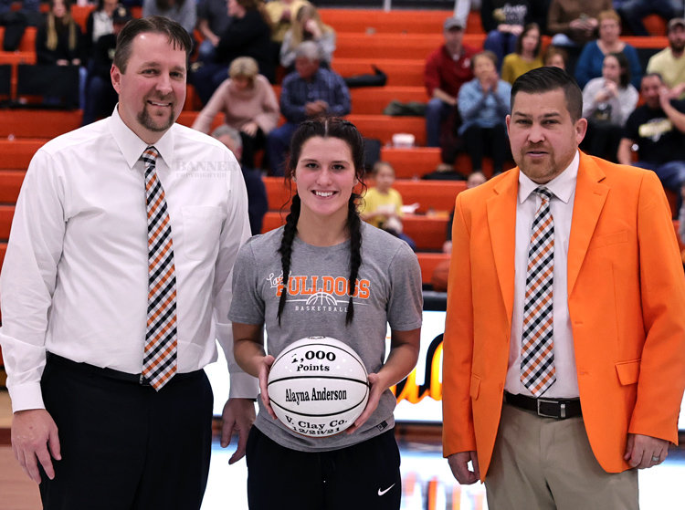 On December 29, at the Richland Christmas Tournament, Alayna Anderson scored her 1,000 point of her High School career against Clay County High School. (L to R) Sean Stephenson, Alayna Anderson and Luke Hughes.