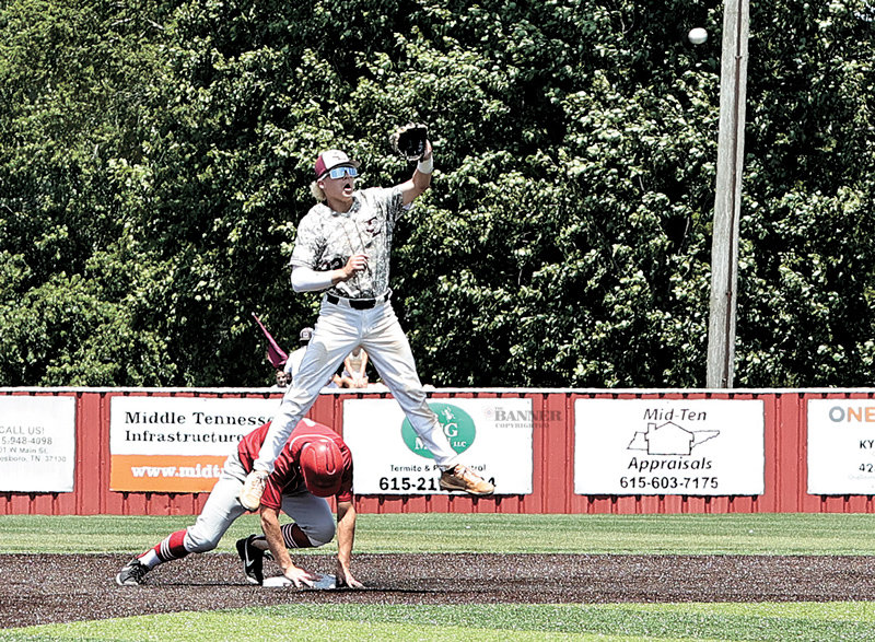 Jackson Cassidy reaches second safely under Eagleville player.