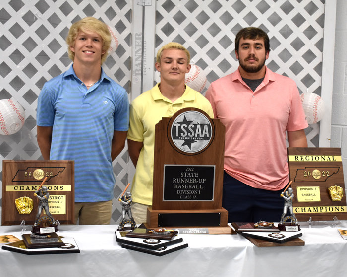 Rebel seniors Zayden McCaslin, Collin McLearen and Jake McDaniel with all the hardware collected by the baseball team this year.
