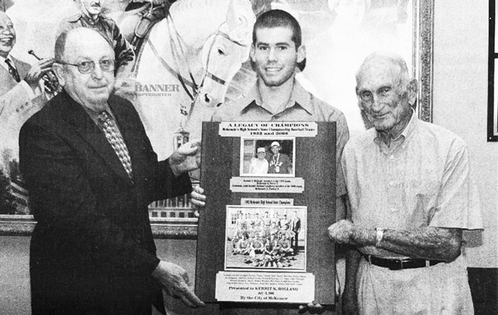 McKenzie Mayor Walter Winchester presents a plaque to Kermit Holland, a member of the 1932 MHS championship baseball team, and his grandson and namesake, John Kermit Laughrey, a member of the 2006 MHS championship team. The plaque included photos of Kermit and John Kermit, following the 2006 championship game and the 1932 championship team.