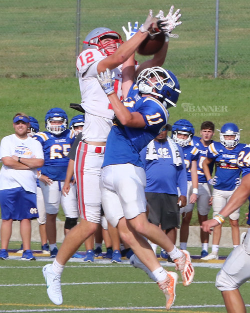 #12 Colt Norden goes up for a catch against a McNairy defender.