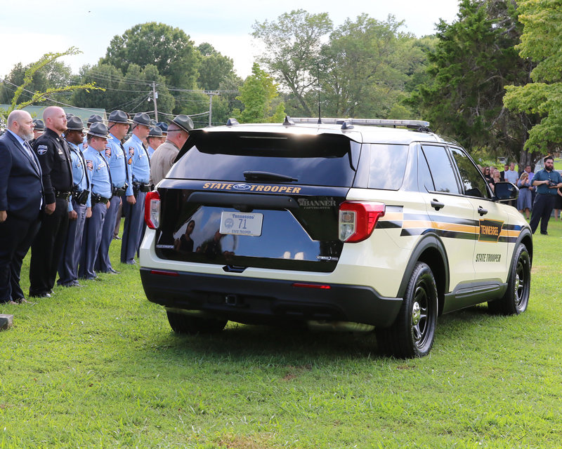 Trooper Lee Russell’s patrol car was parked near the grave site.