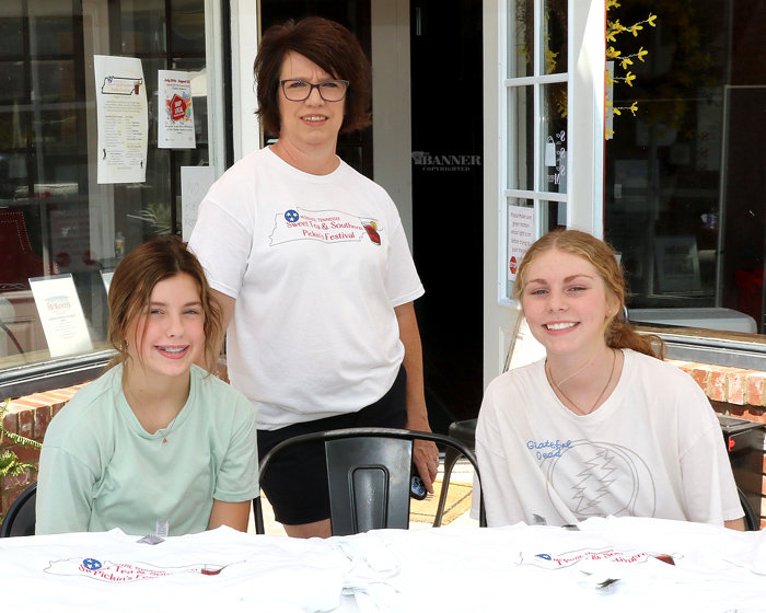 McKenzie Chamber of Commerce was selling event t-shirts. Pictured are Kelcie Stephenson, Monica Heath, and Morgan Little.