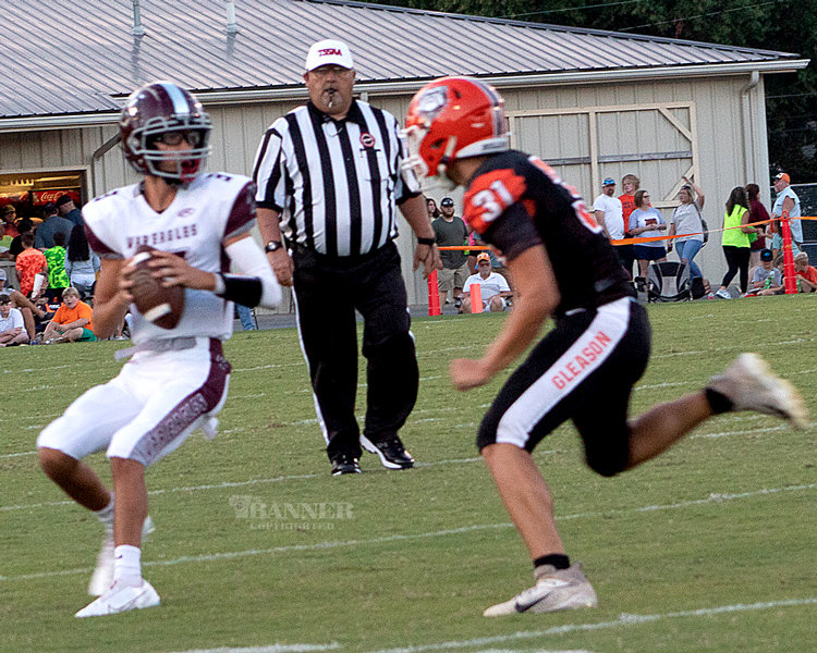 Jaxon Mims (3) rolls out to pass downfield.
