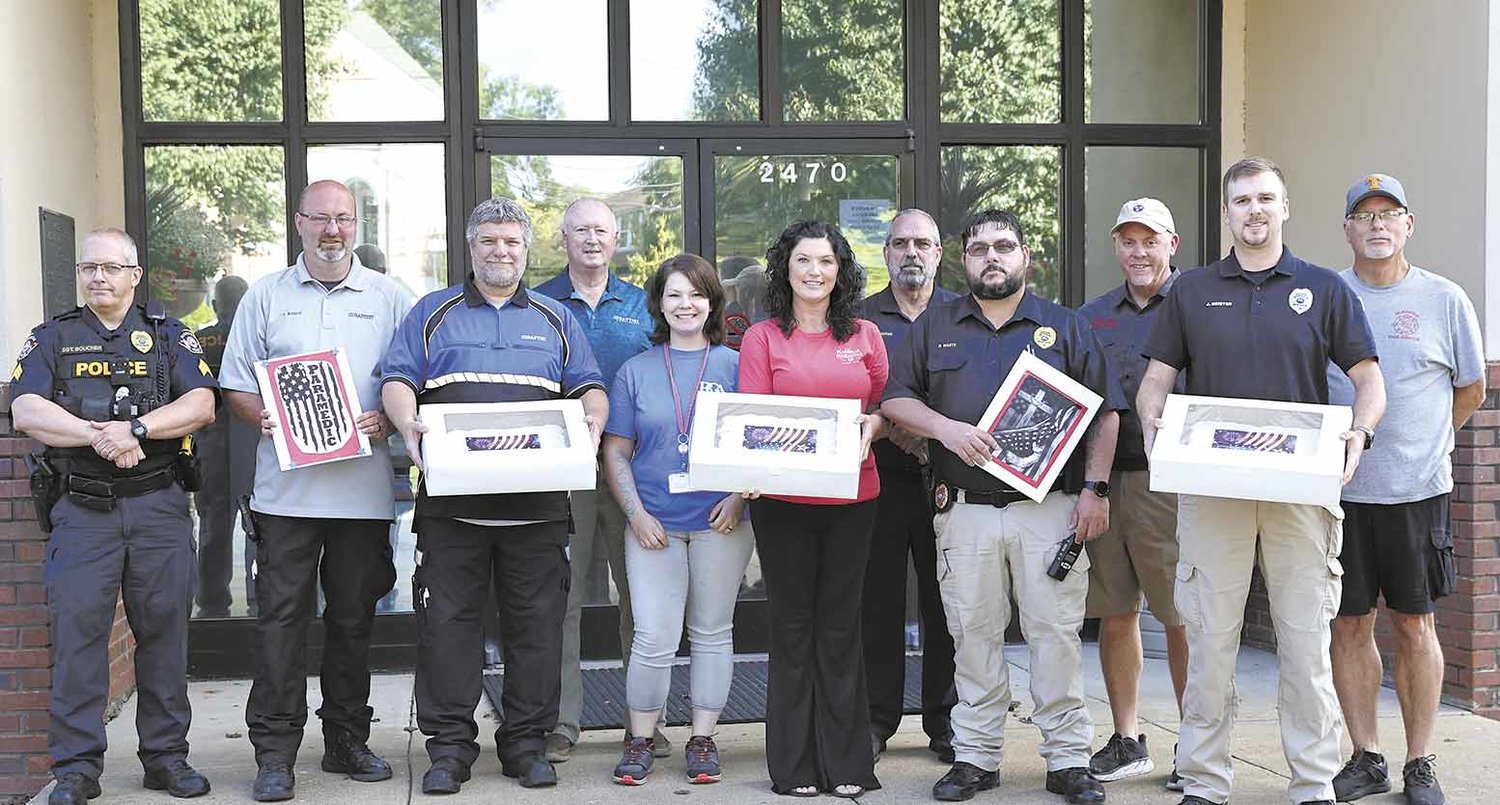 Cash Express in McKenzie Tenn. honored local first responders with cards and cakes in remembrance of September 11, 2001. Photo by Joel Washburn.