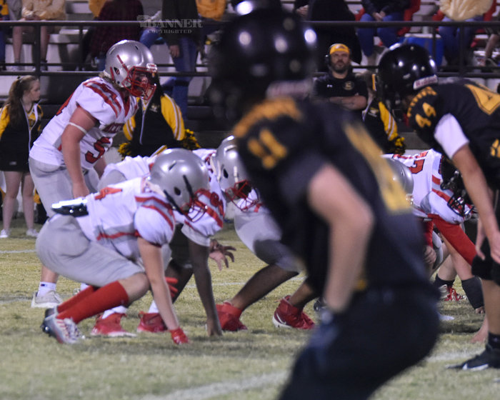 Maddox Sheill (54) lined up in the Rebel backfield.