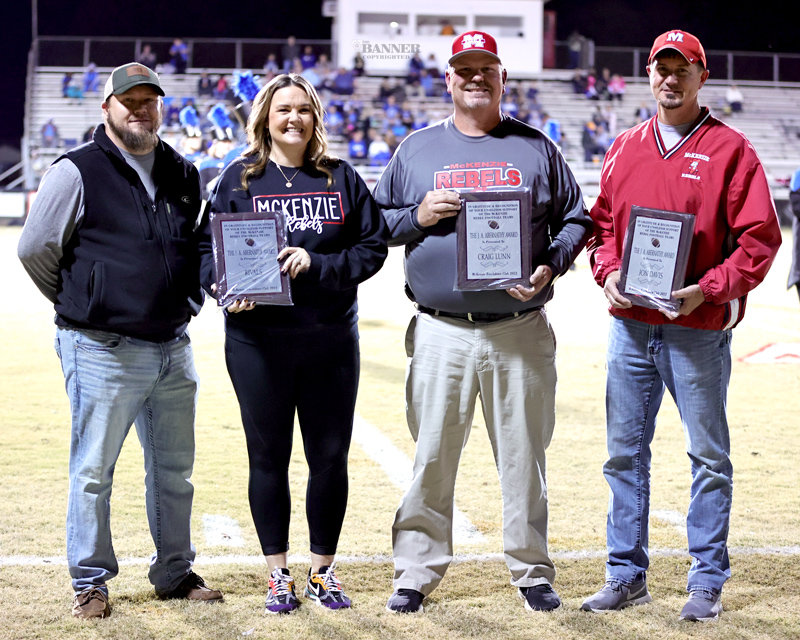 J.A. Abernathy Award - Luke and Erica Rawls of Rivals Sports Bar and Grill and Craig Lunn and Jon Davis all receive the J.A. Abernathy Award from George Cassidy, president of the McKenzie Touchdown Club.
