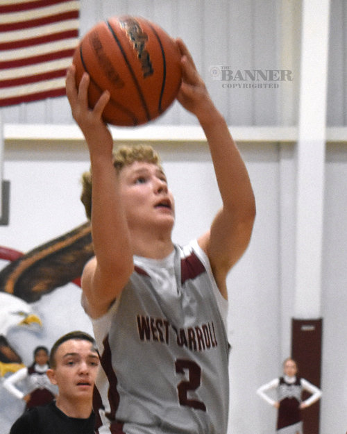 Zac Fowler (2) heads for a layup against Greenfield.
