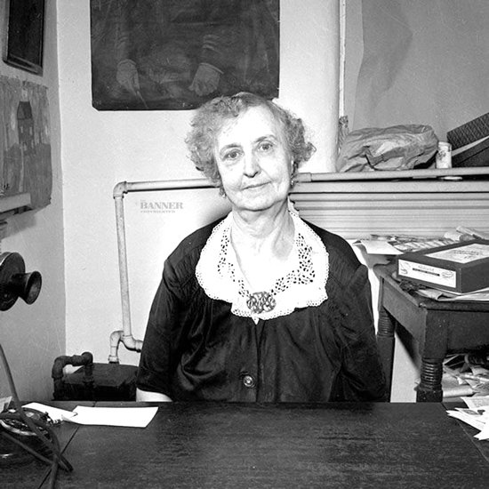 Lula C. Naff in her Ryman Auditorium office under the stairs in 1945.