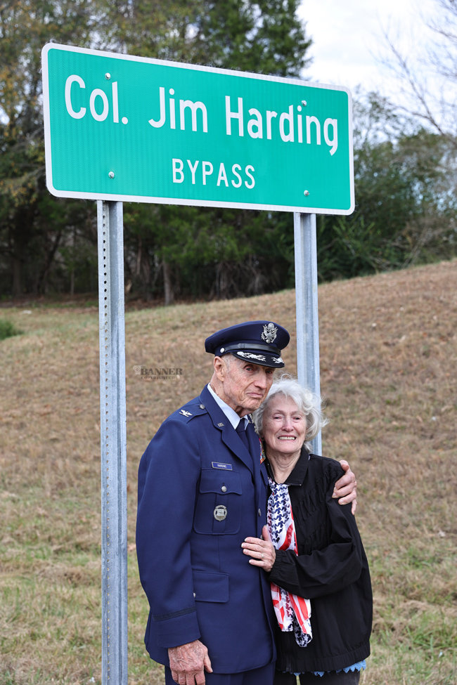Colonel Harding and his wife, Barbara stand under the new sign in honor of the colonel.