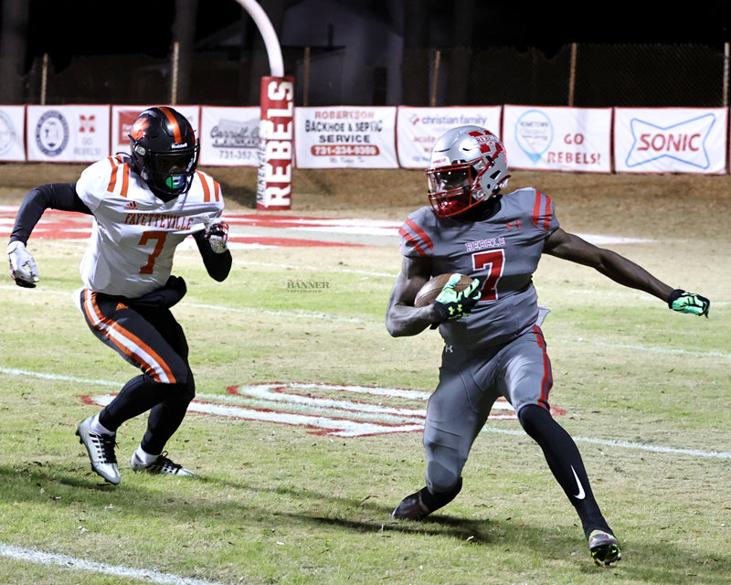 Marquez Taylor rushes for the Rebels.