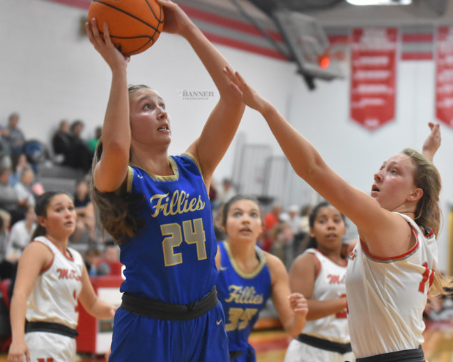 Lilly Kee (24) attempts a shot over Savannah Davis (14). Both ladies had 26 points each in the contest.