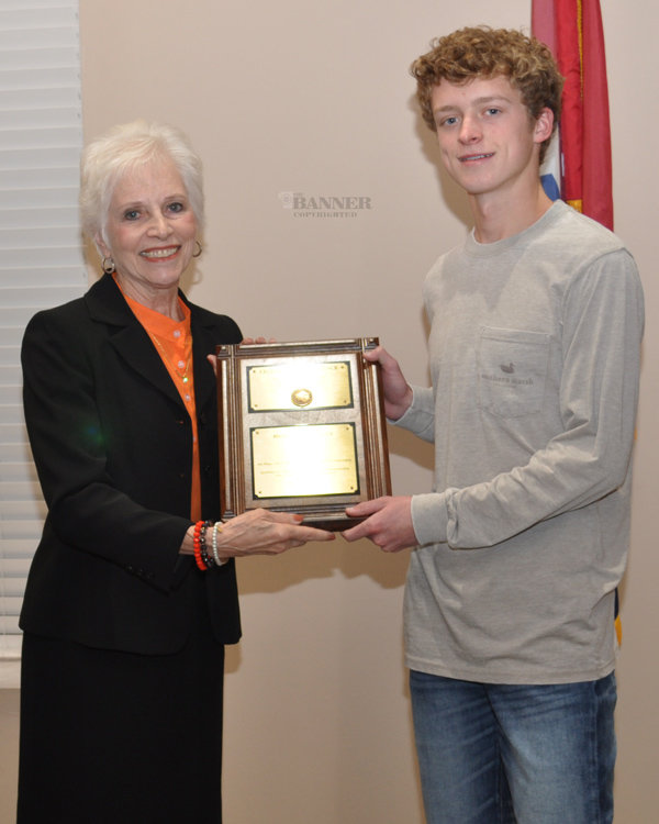 Mayor Nina Smothers presents Huntingdon High School cross-country runner Colton King the Town of Huntingdon’s Pinnacle of Excellence Award.