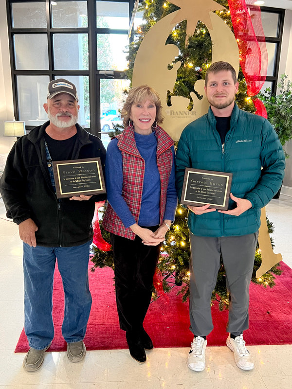 Mayor Jill Holland (center) recognized Steve Watson (left) and Garrett Burns (right) on November 22 for their service on the McKenzie City Council. The two councilmen retired from their positions and did not seek re-election.