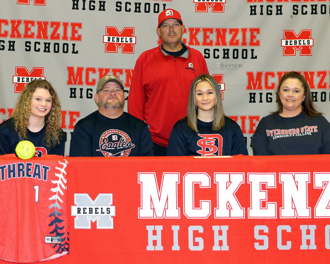 Katie Chesser signs with Dyersburg State. Pictured (L to R): Meya, Jason, Katie, and Samantha Chesser and Dyersburg State Coach George White.