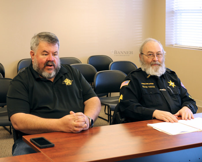 Sheriff Andy Dickson and Sergeant Dwayne Tordsen explain about the new Evidence-Based Re-Entry Program for inmates.