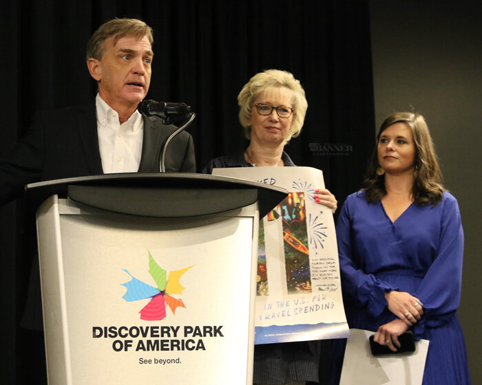 Tennessee Tourism Commissioner Mark Ezell; Marty Marbry, West Tennessee Division Manager, Department of Tourism; and Kasey Muench, new executive director of Northwest Tennessee Tourism, display the poster illustrating Tennessee is 11th in the nation in tourism visitors.