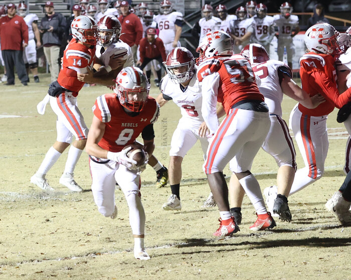 Brady Brewer (#8) finds the gap and goes for the touchdown.
