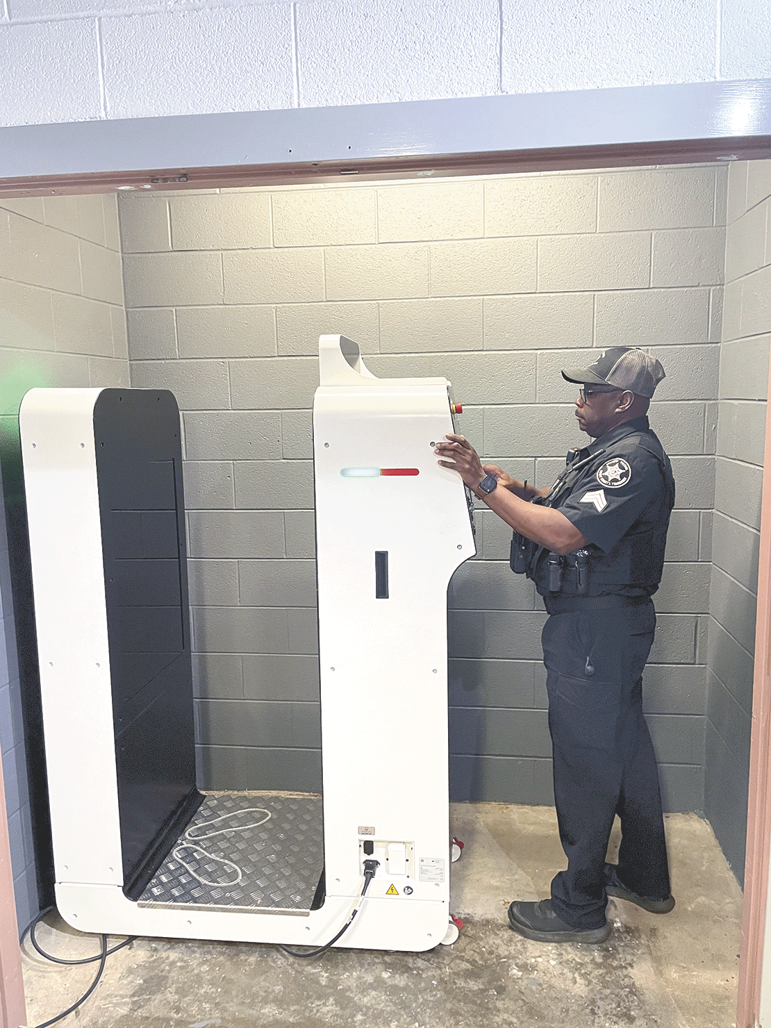 Pictured showing how to use the machine is Sgt. Jerry Wilson. (submitted photo).