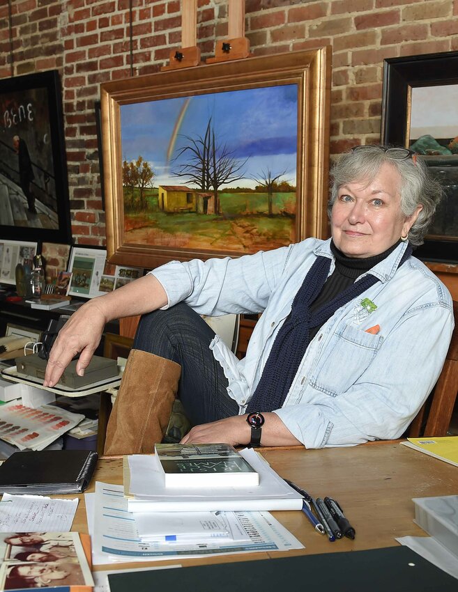 Flora artist Sanders McNeal works and poses for pictures in her studio on Main Street in downtown Flora on Monday, March 29, 2021.