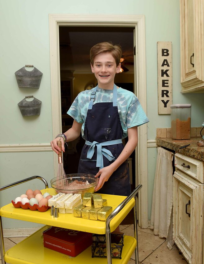 Chef Andrew Clark, 11, works on vegan red velvet and chocolate cakes in the kitchen of his family&rsquo;s home in Madison, Miss., on Friday, March 26, 2021. Andrew appeared in n episode in Season 9 of the Kid&rsquo;s Baking Championship on the Food Network.