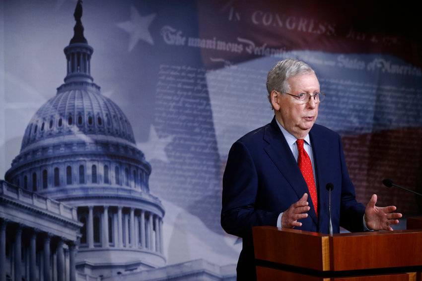 Senate Majority Leader Mitch McConnell of Ky. speaks with reporters after the Senate approved a nearly $500 billion coronavirus aid bill, Tuesday, April 21, 2020, on Capitol Hill in Washington. (AP Photo/Patrick Semansky)
