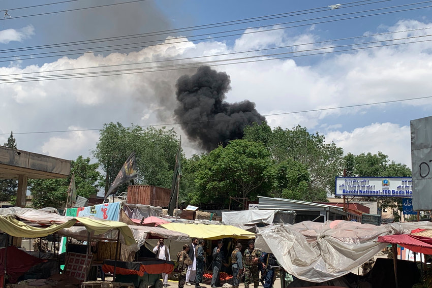 Smokes rises from a hospital after gunmen attacked in Kabul, Afghanistan, Tuesday, May 12, 2020. Gunmen stormed the hospital in the western part of the Afghan capital on Tuesday, setting off a gun battle with the police, officials said. (AP Photo/Rahmat Gul)