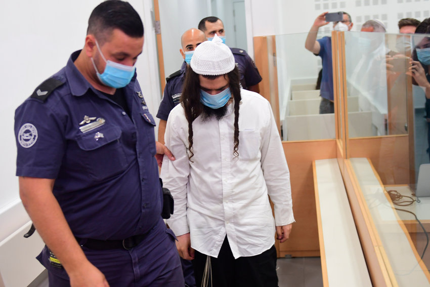 Israeli right-wing activist Amiram Ben-Uliel, brought to the Central Lod District Court for a verdict, in the city of Lod, Israel, 18  May 2020,  Ben-Uliel the suspect in the Duma arson attack was convicted on three counts of murder, in what's known as Duma arson attack, over a firebombing of a home in the village of Duma near the West Bank city of Nablus in July 2015 in which three Palestinians from Dawabsha family have killed a toddler and his two parents.