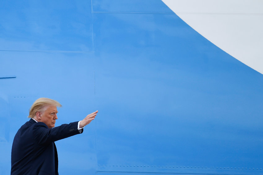 President Donald Trump waves from the top of the steps of Air Force One at Andrews Air Force Base in Md., Friday, July 10, 2020. Trump is heading to Florida to visit Southern Command, attend a roundtable event at a Doral church where he will speak with Cuban and Venezuelan dissidents and attend a fundraiser in Hillsboro Beach. (AP Photo/Susan Walsh)
