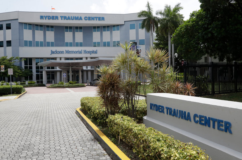 The entrance to the Ryder Trauma Center at Jackson Memorial Hospital is shown, Thursday, July 9, 2020, in Miami. Florida reported on Thursday the biggest 24-hour jump in hospitalizations, with more than 400 patients being admitted. (AP Photo/Wilfredo Lee)