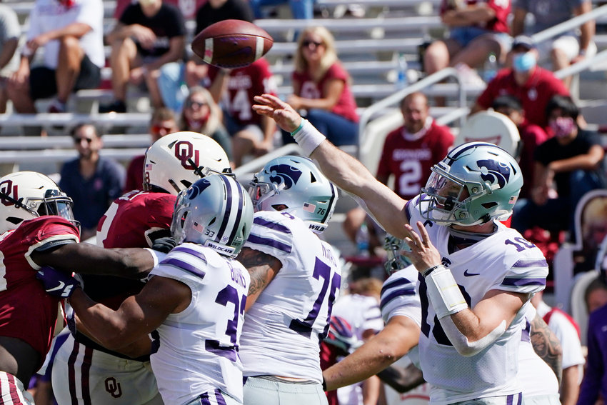 Kansas State quarterback Skylar Thompson (10) passes in the first half of an NCAA college football game against Oklahoma Saturday, Sept. 26, 2020, in Norman, Okla. (AP Photo/Sue Ogrocki).