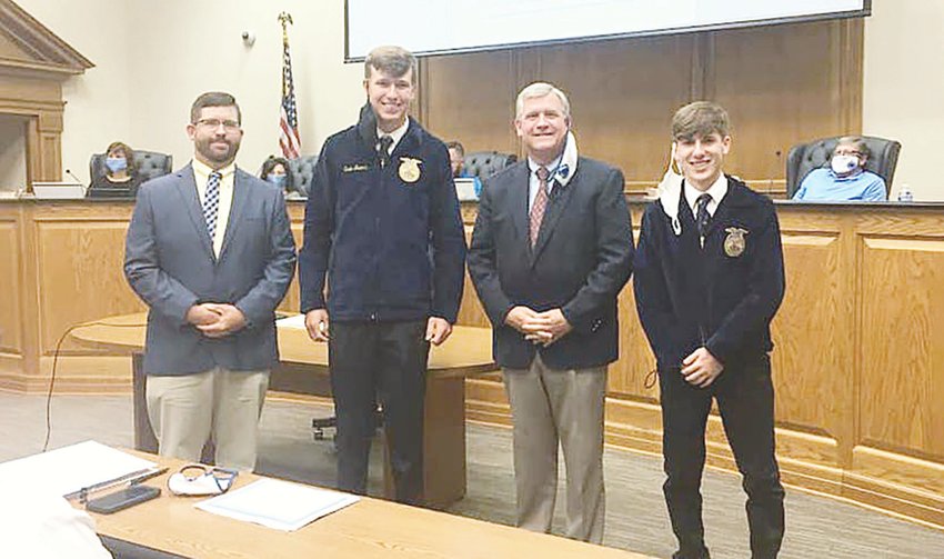 Pictured, from left to right, is Dora High FFA sponsor Joshua Tubbs, Dora FFA member Evan Mears, Walker County Schools Superintendent Dr. Joel Hagood, and Dora FFA member Garrett Lomoro. Dora High School's FFA chapter was recognized at a recent school board meeting for receiving national recognition.