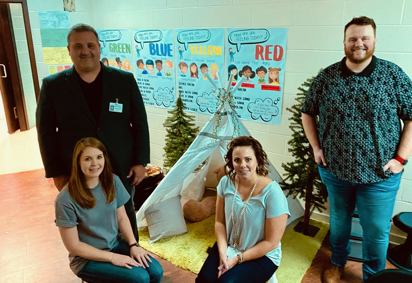 Pictured is one of the calm camps recently created at Parrish Elementary School. Behavioral interventionist Anthony Sellers, at far right, is pictured next to Walker County Schools Mental Health Director Misty Whisenhunt and Parrish school leaders.